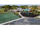 Aerial view showcases community features like a basketball court, playground, and clubhouse with ample parking at 5814 117Th E Ter, Parrish, FL 34219