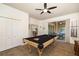 Game room features a pool table and access to the outdoor patio at 5814 117Th E Ter, Parrish, FL 34219