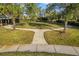 Scenic green space featuring a walking path under mature trees at 5814 117Th E Ter, Parrish, FL 34219