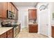 Stylish kitchen featuring stainless steel appliances, granite countertops, and decorative tile backsplash at 5814 117Th E Ter, Parrish, FL 34219