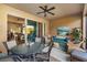 Inviting lanai with ceiling fan, comfortable seating area, and dining table, ideal for relaxation and entertaining at 5814 117Th E Ter, Parrish, FL 34219