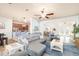 Bright living room featuring a comfortable gray sofa, stylish blue rug, and inviting open floor plan at 5814 117Th E Ter, Parrish, FL 34219