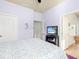 View of the main bedroom showcasing the closet, ensuite bathroom, and calming wall color at 5814 117Th E Ter, Parrish, FL 34219