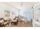 Bright sitting area with cozy chairs, arched windows and coastal decor accents at 5814 117Th E Ter, Parrish, FL 34219