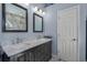 Elegant bathroom showcasing double vanity, marble countertops, and decorative mirrors at 5911 Laurel Creek Trl, Ellenton, FL 34222