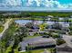 Beautiful aerial view of the waterfront community with lush landscaping and convenient carport parking at 617 Estuary Dr # 617, Bradenton, FL 34209