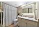 Well-lit bathroom featuring a shower-tub combo, a cream vanity, and a neutral color palette at 617 Estuary Dr # 617, Bradenton, FL 34209