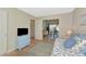 Cozy bedroom with daybed, blue accents, and view into the dining room at 617 Estuary Dr # 617, Bradenton, FL 34209