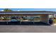 Carport for unit 617 with parking space and well-maintained landscaping around the building at 617 Estuary Dr # 617, Bradenton, FL 34209