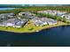 Gorgeous aerial view of the waterfront community with lush landscaping and a serene pond at 617 Estuary Dr # 617, Bradenton, FL 34209