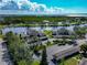 Attractive aerial view of the waterfront community featuring lush landscaping and serene pond at 617 Estuary Dr # 617, Bradenton, FL 34209