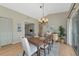 Dining area with access to the outdoors and modern light fixture at 617 Estuary Dr # 617, Bradenton, FL 34209