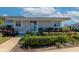 Exterior elevation shows the front of a building with fresh landscaping and neutral color scheme at 617 Estuary Dr # 617, Bradenton, FL 34209