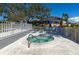 Relax in the community hot tub with surrounding lounge chairs and lush tropical landscaping at 617 Estuary Dr # 617, Bradenton, FL 34209