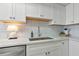 Bright kitchen features white cabinets, white subway tile backsplash, quartz countertops, and stainless appliances at 617 Estuary Dr # 617, Bradenton, FL 34209