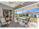 Relaxing screened lanai with table and chairs overlooking the community at 617 Estuary Dr # 617, Bradenton, FL 34209