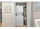 Convenient laundry closet with stacked washer, dryer, and shelving at 617 Estuary Dr # 617, Bradenton, FL 34209