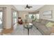 Comfortable living room with neutral decor, ceiling fan, and ample natural light at 617 Estuary Dr # 617, Bradenton, FL 34209