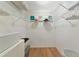 Well-organized walk-in closet with wire shelving and laminate flooring at 617 Estuary Dr # 617, Bradenton, FL 34209