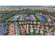 Gorgeous aerial view of a community with a golf course, ponds and single Gathering homes at 6326 Grand Oak Cir # 203, Bradenton, FL 34203