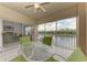 Enjoy the views of the water from this balcony with comfortable seating, ceiling fan, and natural light at 6326 Grand Oak Cir # 203, Bradenton, FL 34203