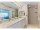 Bright bathroom featuring a double sink vanity with a large walk-in shower at 6326 Grand Oak Cir # 203, Bradenton, FL 34203