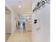 Bright foyer featuring tile flooring, neutral walls, and open access to the living area, providing a seamless transition at 6326 Grand Oak Cir # 203, Bradenton, FL 34203