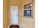 Inviting front entrance with a secure door and a bright window, creating a welcoming facade for this home at 6326 Grand Oak Cir # 203, Bradenton, FL 34203
