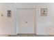 Hallway with a double door closet offering ample storage space, complemented by modern decor and lighting at 6326 Grand Oak Cir # 203, Bradenton, FL 34203