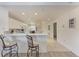 Bright kitchen features a breakfast bar with two cushioned stools at 6326 Grand Oak Cir # 203, Bradenton, FL 34203