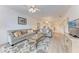 Comfortable living room with two sofas, neutral color palette, and an open floor plan at 6326 Grand Oak Cir # 203, Bradenton, FL 34203