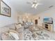 Comfortable living room with two sofas, neutral color palette, and an open floor plan at 6326 Grand Oak Cir # 203, Bradenton, FL 34203