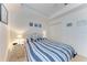 Serene main bedroom featuring a plush bed, soft lighting, and a spacious closet, perfect for relaxation and storage at 6326 Grand Oak Cir # 203, Bradenton, FL 34203