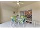 Covered patio with comfortable seating and a ceiling fan, offering a relaxing outdoor space for dining and lounging at 6326 Grand Oak Cir # 203, Bradenton, FL 34203