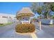 Community entrance featuring a decorative sign and landscaping, providing a welcoming arrival at 635 30Th W Ave # F209, Bradenton, FL 34205