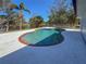 Backyard pool with cool blue water surrounded by a spacious concrete patio at 6704 35Th W Ave, Bradenton, FL 34209