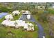 Beautiful aerial shot of residences with lush lawns, parking, palm trees, and scenic landscaping throughout the community at 801 Spring Lakes Blvd # 801, Bradenton, FL 34210
