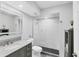 Modern bathroom features a glass-enclosed shower, vanity, and gray accents at 801 Spring Lakes Blvd # 801, Bradenton, FL 34210
