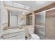 Bathroom with granite countertops, tiled shower, and plenty of natural light at 801 Spring Lakes Blvd # 801, Bradenton, FL 34210