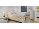 Cozy bedroom with warm lighting, wood-look floors and comfortable decor at 801 Spring Lakes Blvd # 801, Bradenton, FL 34210