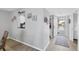 Bright entryway with stylish decor, wood-look floors, and a view to the kitchen at 801 Spring Lakes Blvd # 801, Bradenton, FL 34210