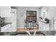 Bright kitchen with modern appliances, a breakfast bar, and a cozy dining area at 801 Spring Lakes Blvd # 801, Bradenton, FL 34210