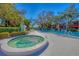 Inviting pool area featuring jacuzzi, surrounded by lush greenery and lounge chairs perfect for relaxation at 801 Spring Lakes Blvd # 801, Bradenton, FL 34210