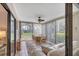 Bright sunroom with floor to ceiling windows, ceiling fan and comfortable furniture at 801 Spring Lakes Blvd # 801, Bradenton, FL 34210