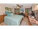 Charming bedroom with unique decor, including a piano and paintings with a comfortable bed at 805 Mcarthur Ave, Sarasota, FL 34243