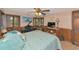 Comfortable bedroom featuring unique paneling, a piano, and lots of natural light at 805 Mcarthur Ave, Sarasota, FL 34243