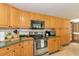 Kitchen with Stainless Steel Appliances and light wood cabinets at 805 Mcarthur Ave, Sarasota, FL 34243