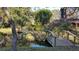 Scenic pond with small bridges and lush greenery, offering a tranquil outdoor setting at 805 Mcarthur Ave, Sarasota, FL 34243