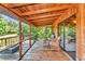 Inviting screened porch with wood ceiling, wicker seating, and lovely views at 805 Mcarthur Ave, Sarasota, FL 34243