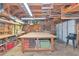 Functional workshop space with pegboard walls, tools, workbenches, and overhead lighting at 805 Mcarthur Ave, Sarasota, FL 34243